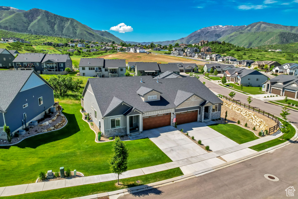 Aerial view of residential area featuring a mountain backdrop