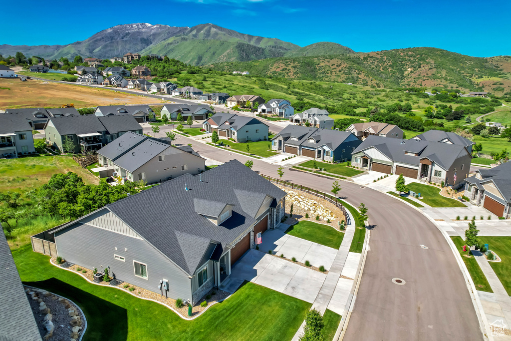 Aerial view of residential area with a mountainous background