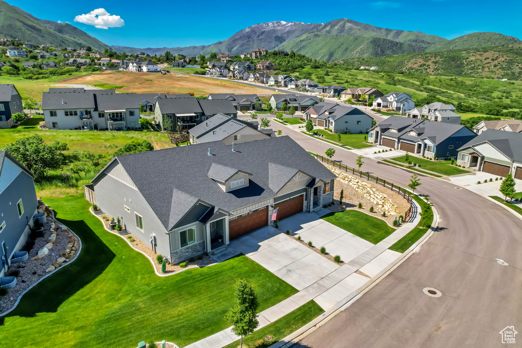 Aerial view of residential area featuring a mountain backdrop