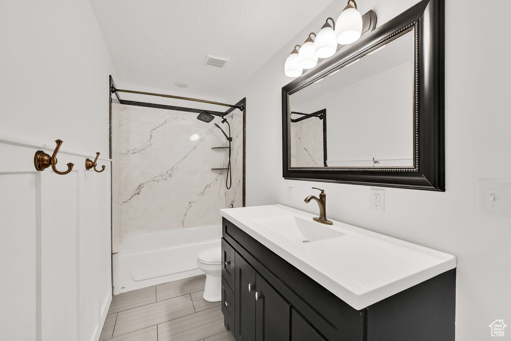 Bathroom featuring vanity and  shower combination