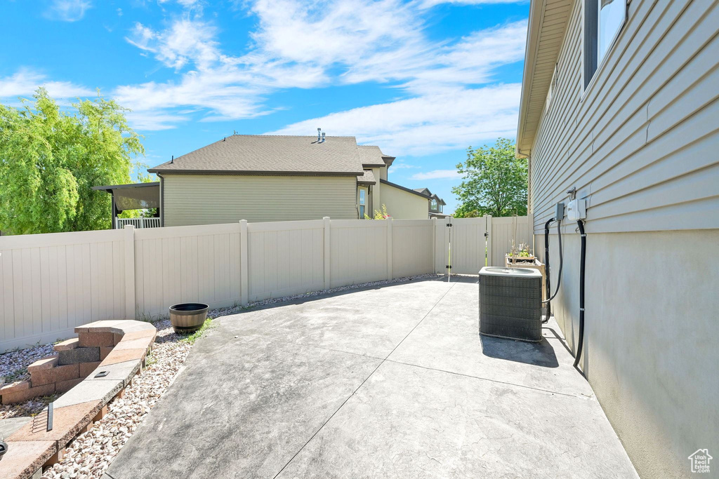 Fenced backyard with a patio area