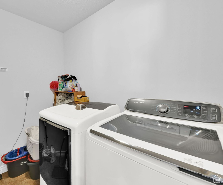 Laundry room featuring washer and clothes dryer