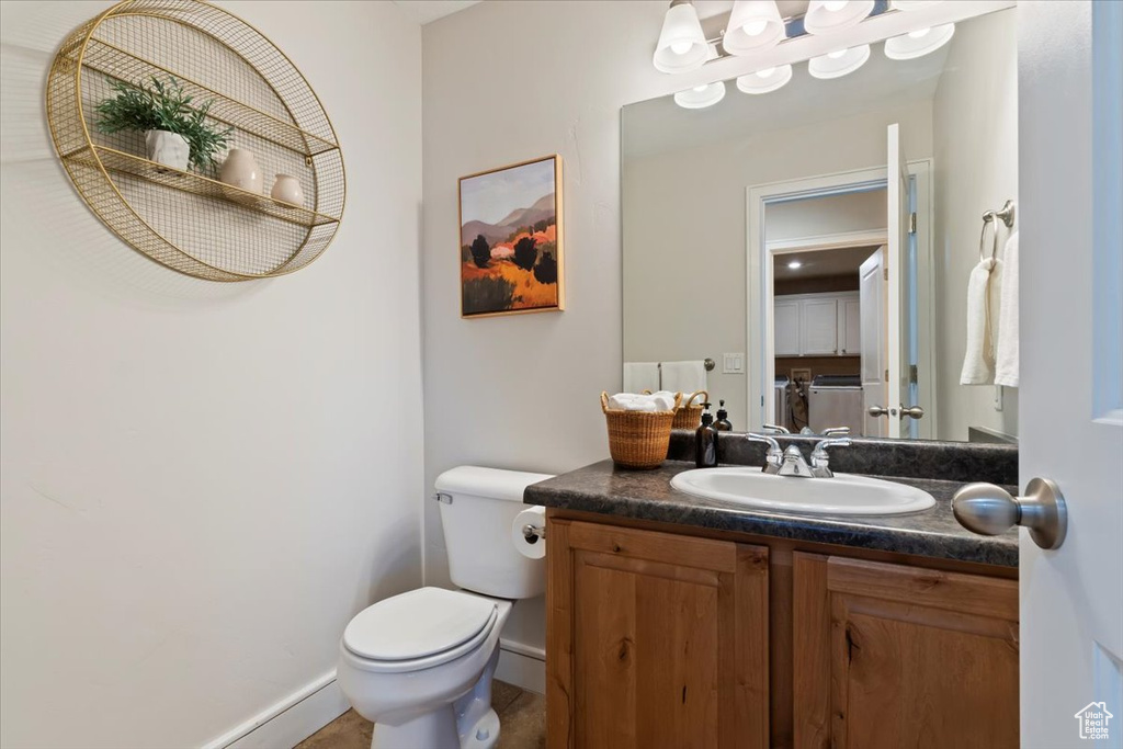Bathroom featuring toilet and vanity