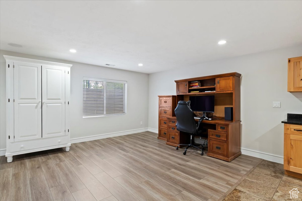 Home office featuring light wood-type flooring and recessed lighting