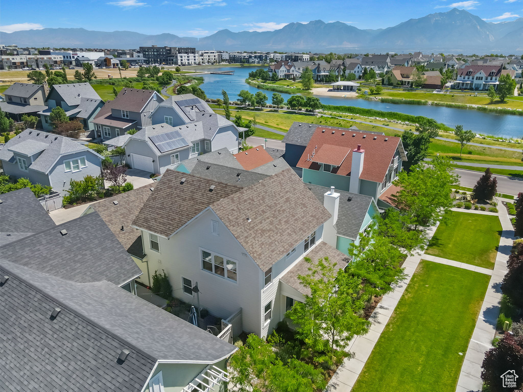 Aerial view of residential area featuring a water and mountain view
