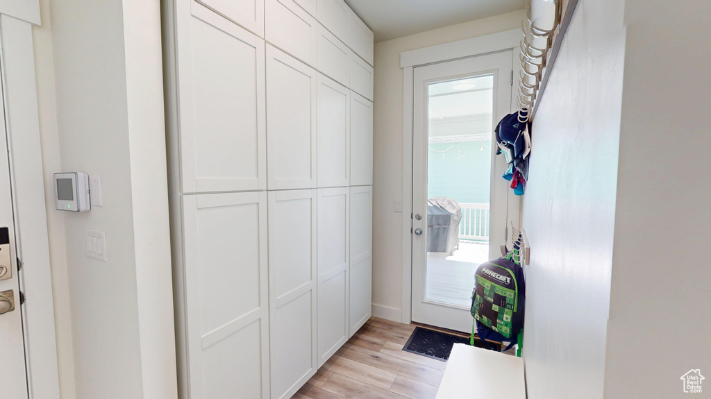 Doorway to outside featuring light wood finished floors