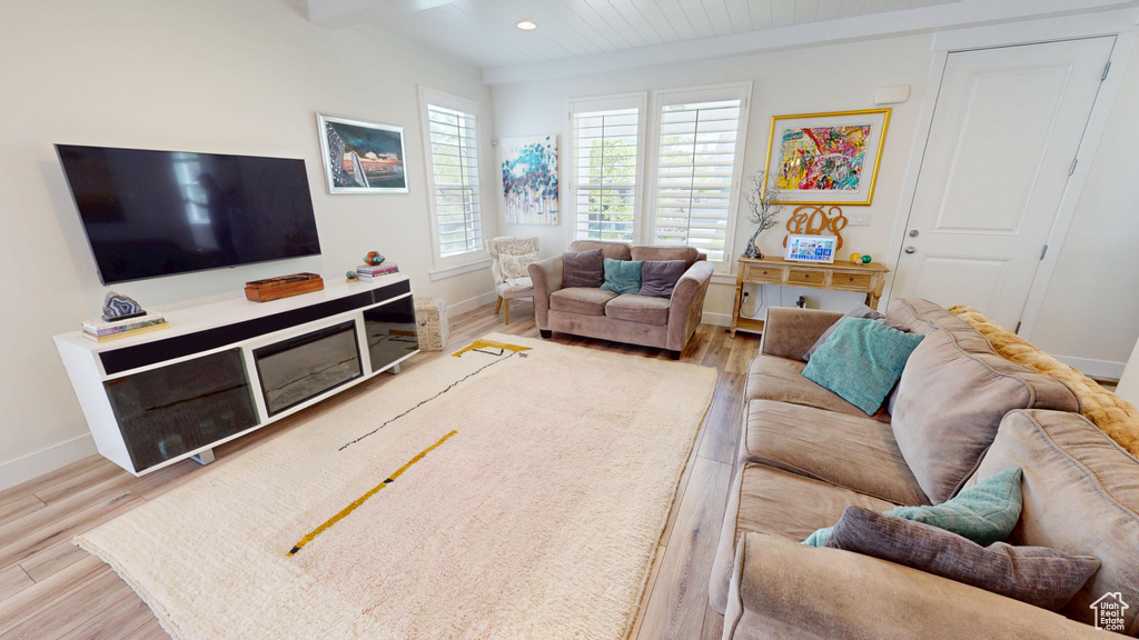 Living room with wood finished floors and recessed lighting