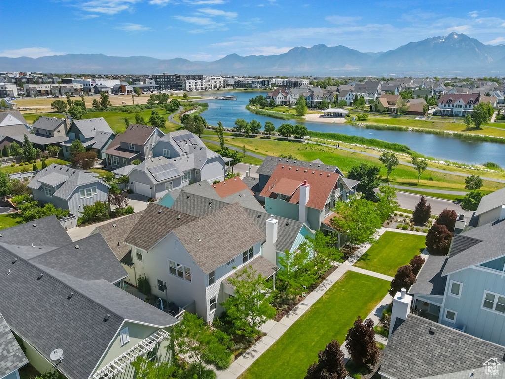 Aerial view of residential area featuring a water and mountain view