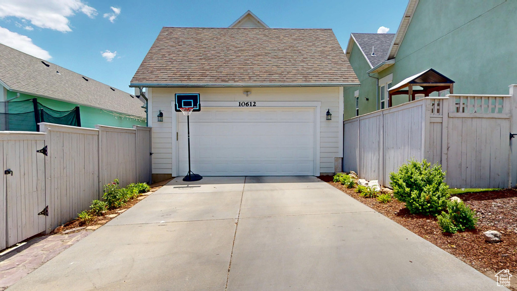 Garage featuring driveway