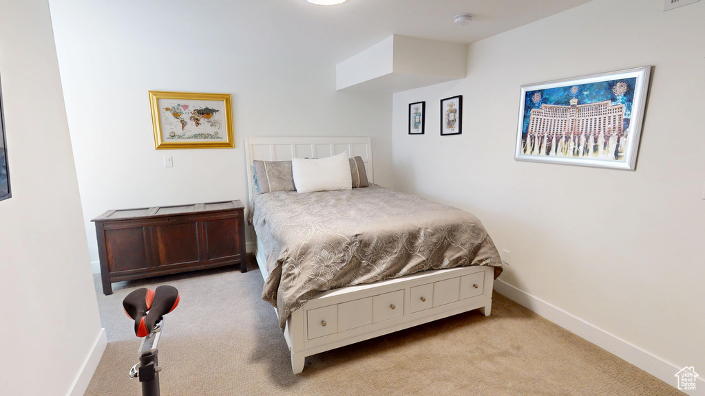 Carpeted bedroom with baseboards