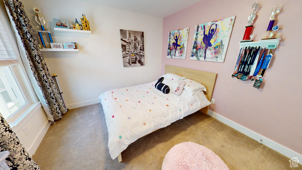 Bedroom with carpet and baseboards