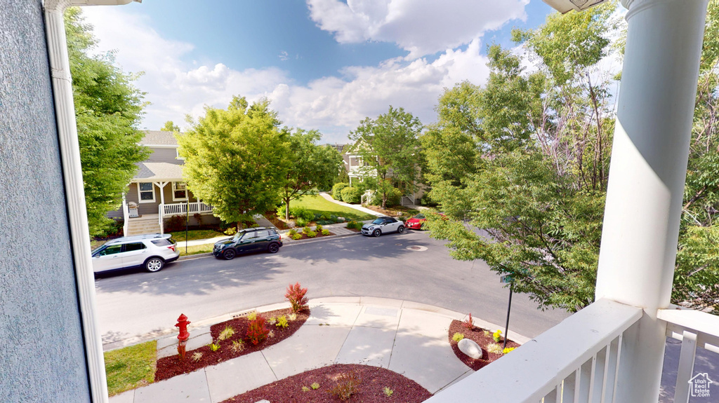 View of asphalt road featuring sidewalks