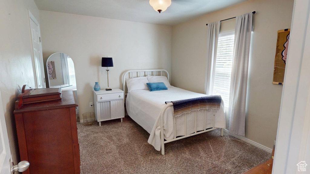 Bedroom with carpet flooring