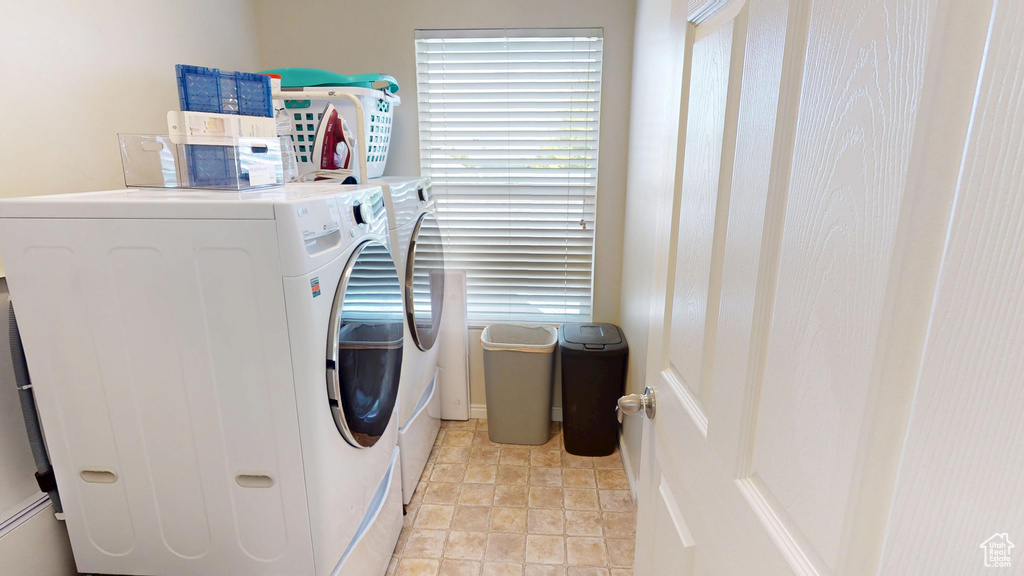 Washroom featuring independent washer and dryer