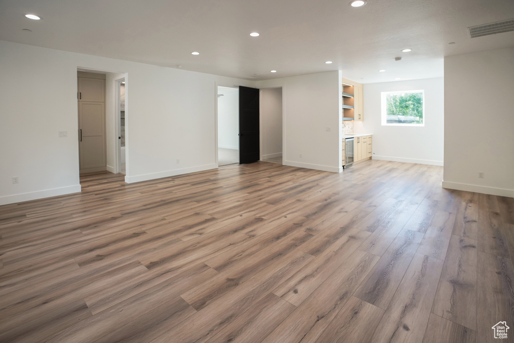 Unfurnished room featuring recessed lighting and light wood-style flooring