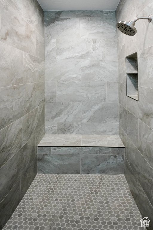 Bathroom featuring tiled shower