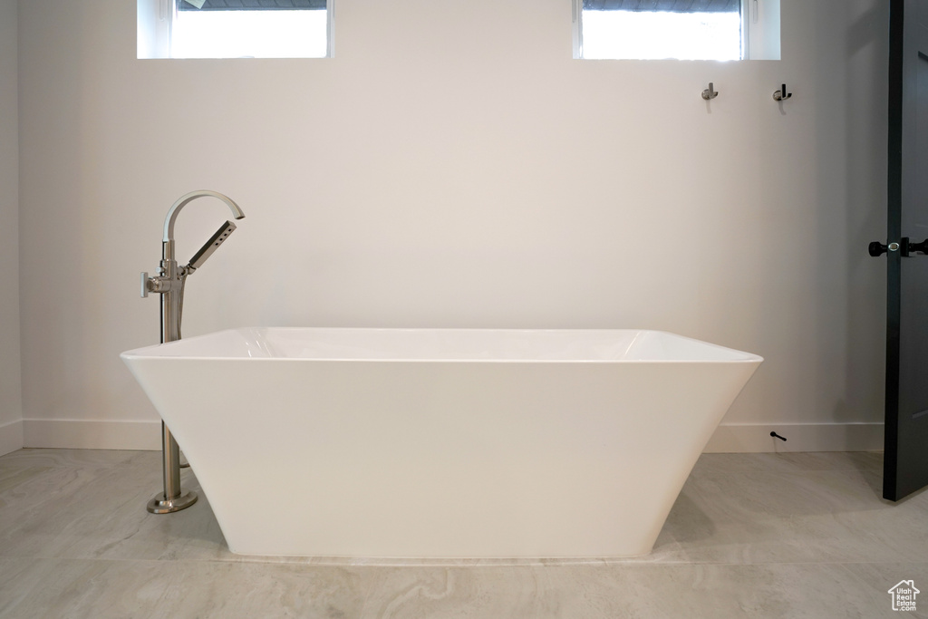 Full bathroom with a soaking tub