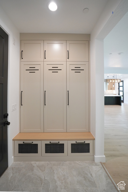 Mudroom featuring a chandelier