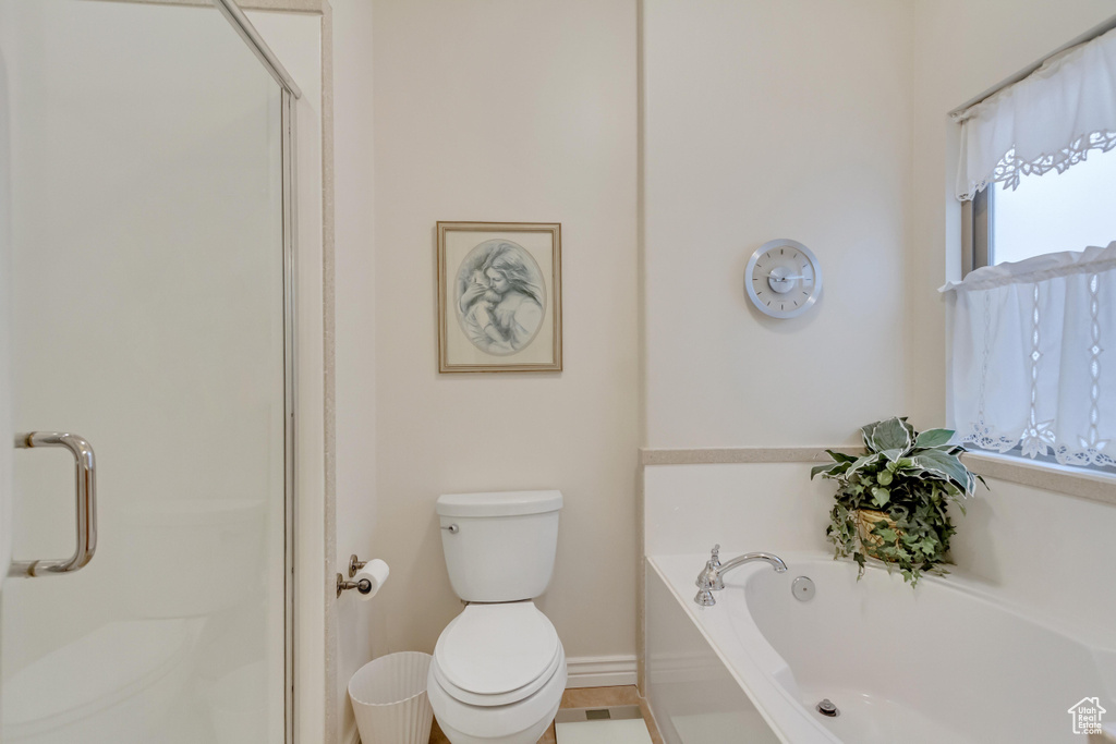 Full bathroom with a shower stall and a bath