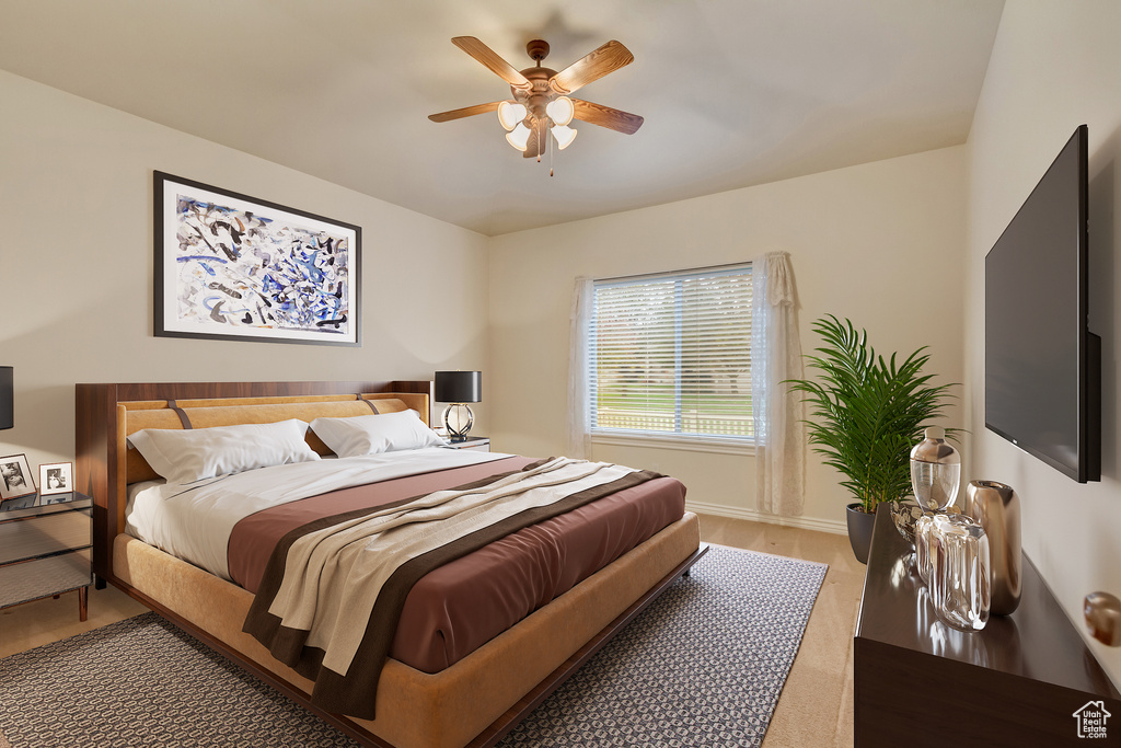 Bedroom featuring light wood finished floors and a ceiling fan