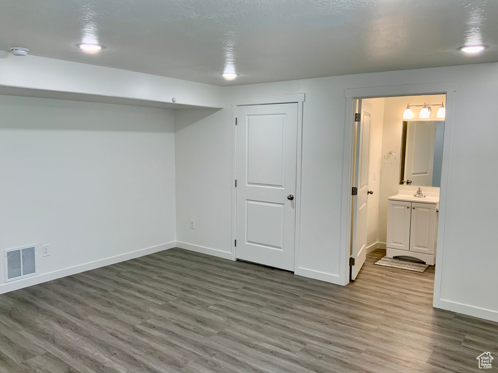 Below grade area with wood finished floors and baseboards
