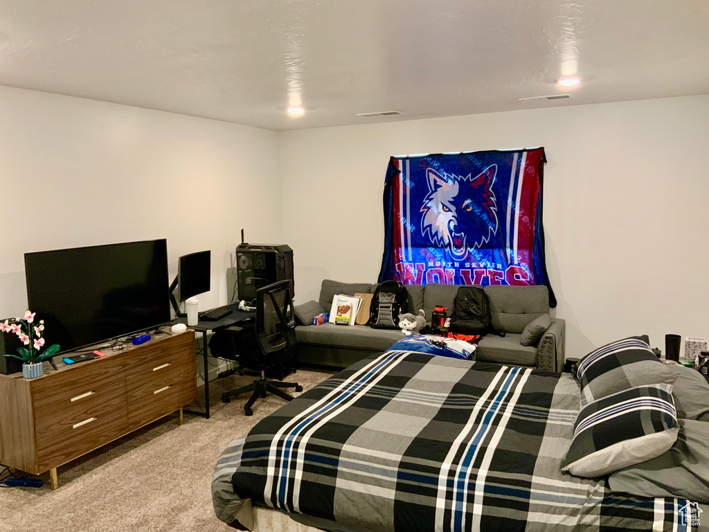 Bedroom with light colored carpet