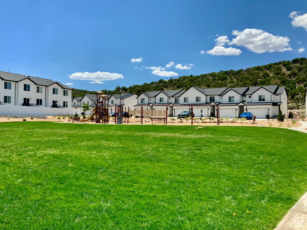 View of property\'s community with a playground and a residential view