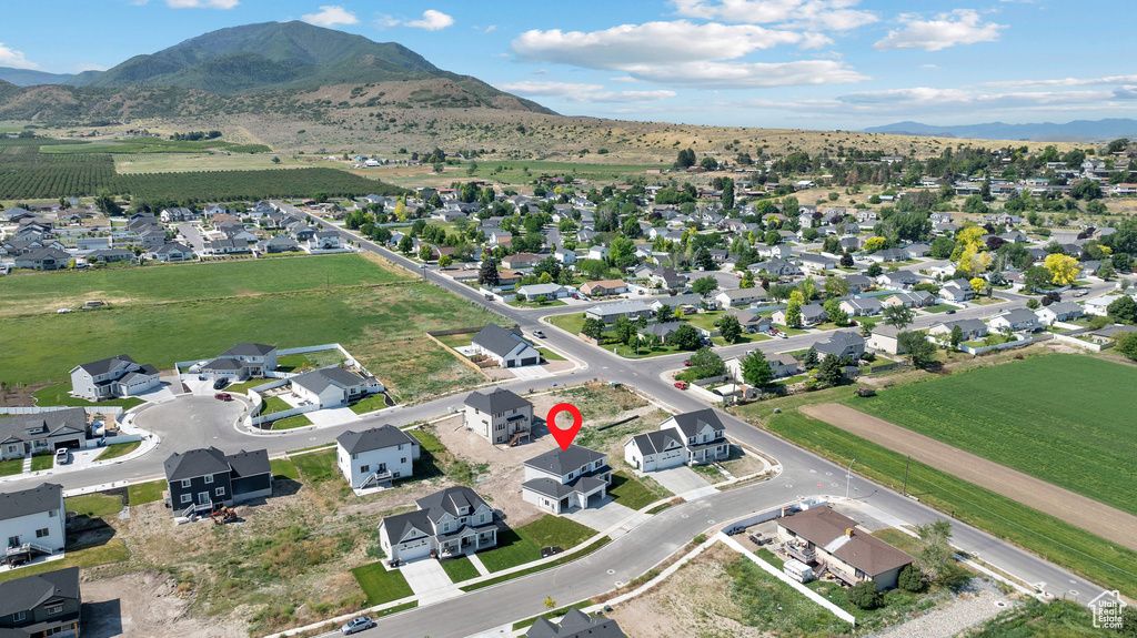 Aerial overview of property's location with mountains and nearby suburban area