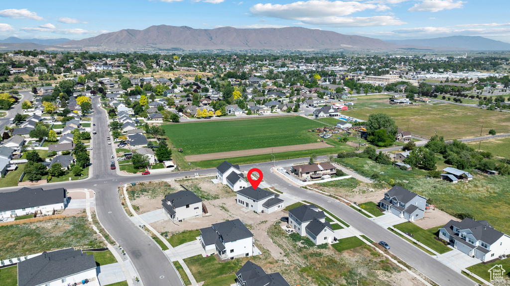 Aerial view of property's location with nearby suburban area