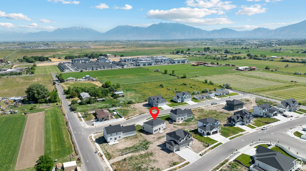 Aerial view of sparsely populated area with a mountain backdrop