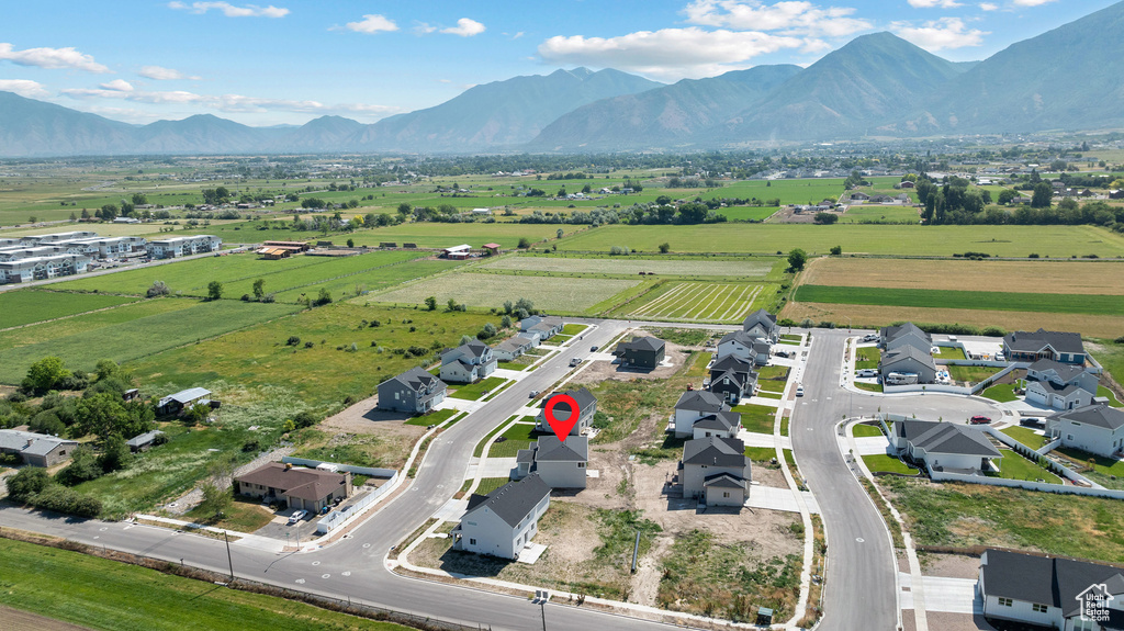 Overview of rural landscape featuring a mountainous background