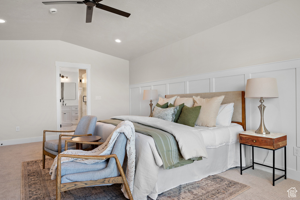 Bedroom featuring light colored carpet, lofted ceiling, ensuite bathroom, recessed lighting, and ceiling fan