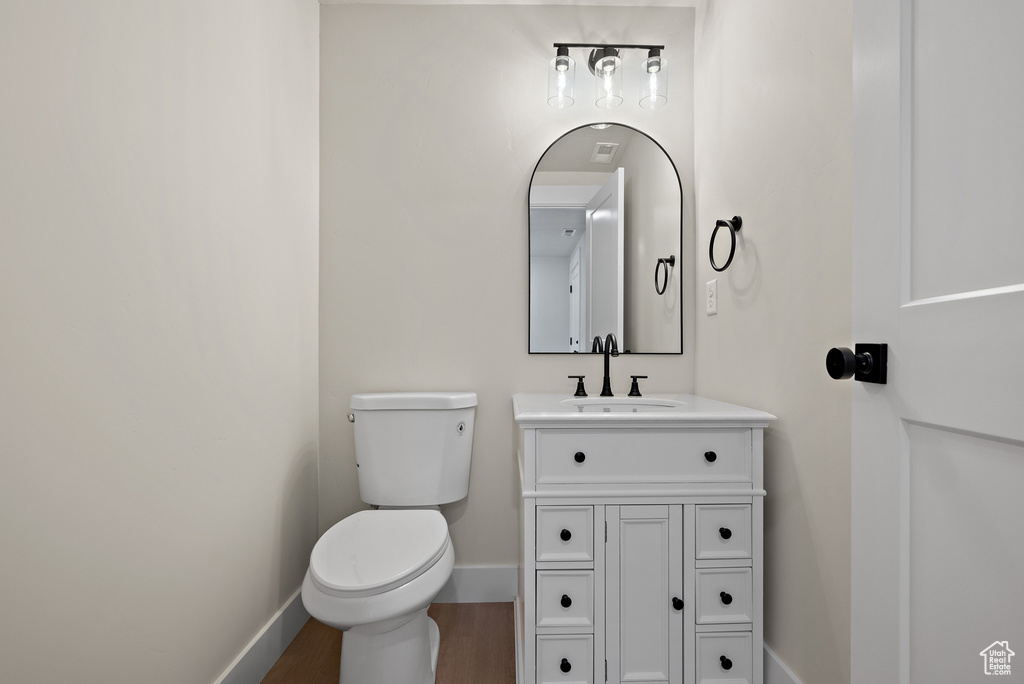 Bathroom with vanity and wood finished floors