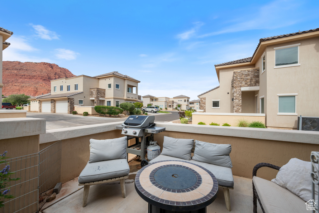 View of patio featuring a residential view, area for grilling, and a mountain view