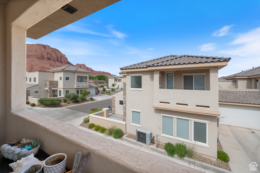 Balcony with a residential view and a mountain view