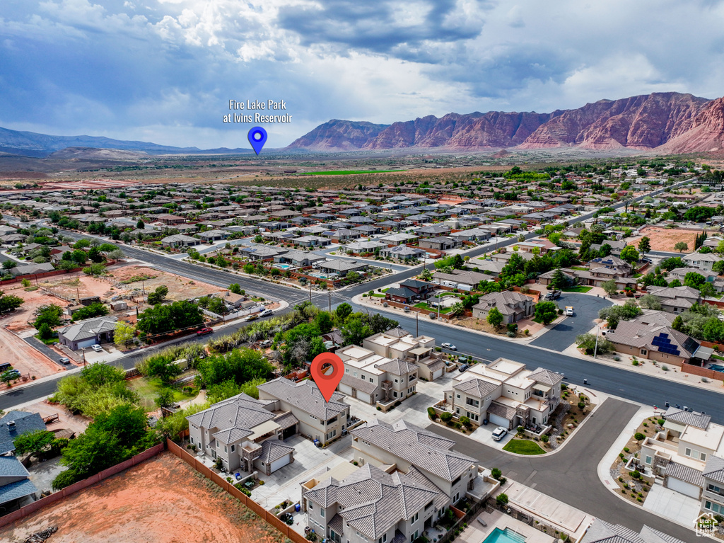 Aerial perspective of suburban area with a mountainous background
