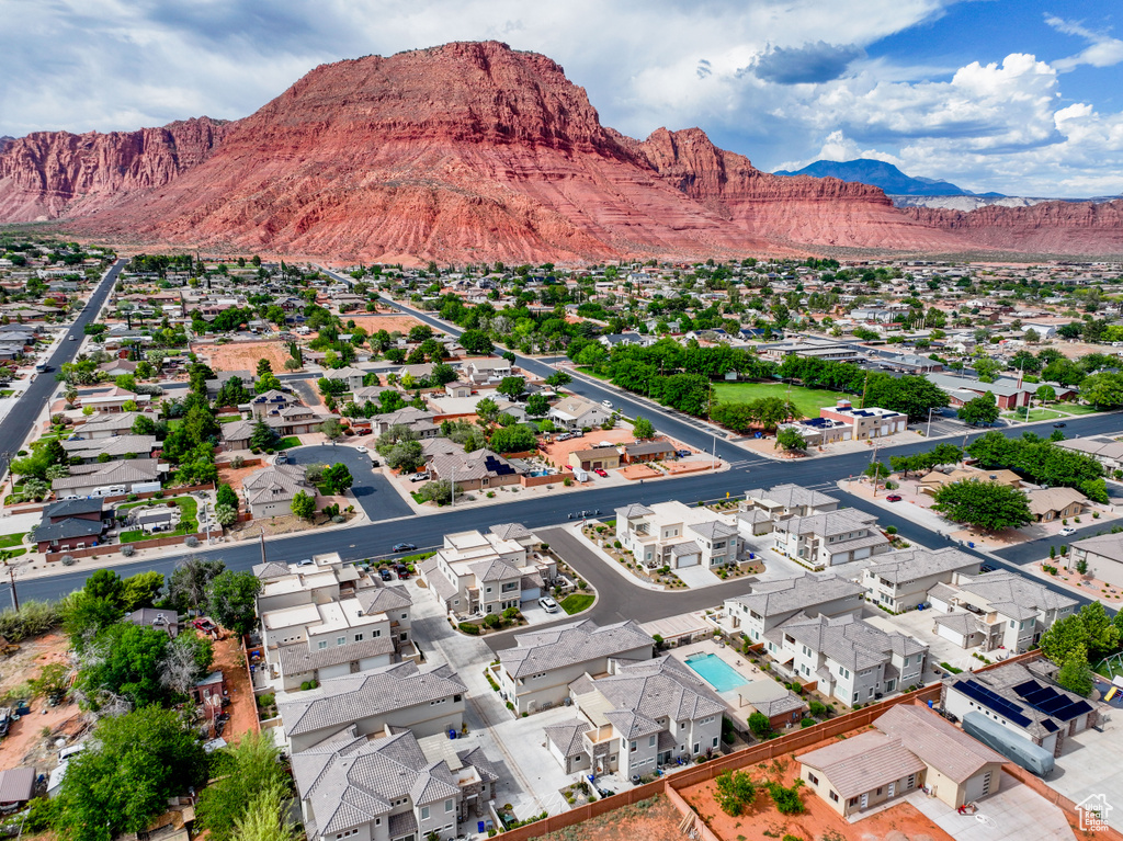 Aerial perspective of suburban area with a mountain backdrop
