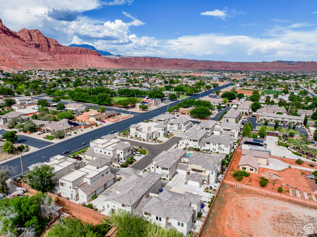 Aerial view of residential area featuring a mountainous background
