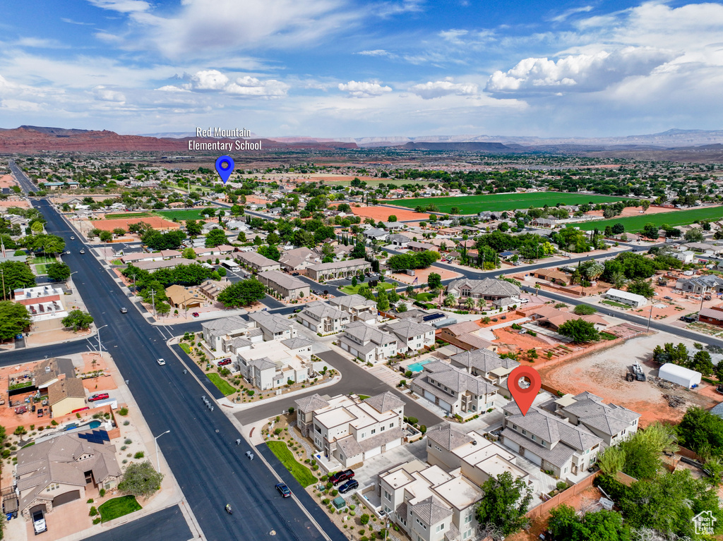 Aerial perspective of suburban area featuring a mountainous background