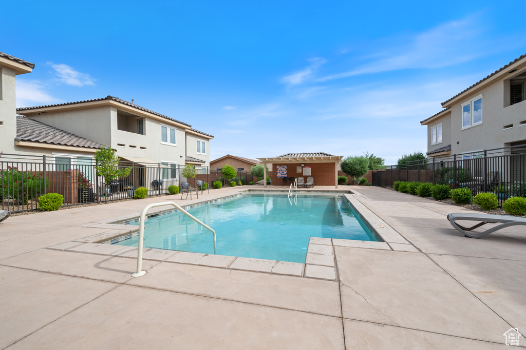 Community pool with a patio