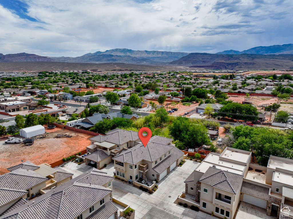 Aerial perspective of suburban area with a mountain backdrop
