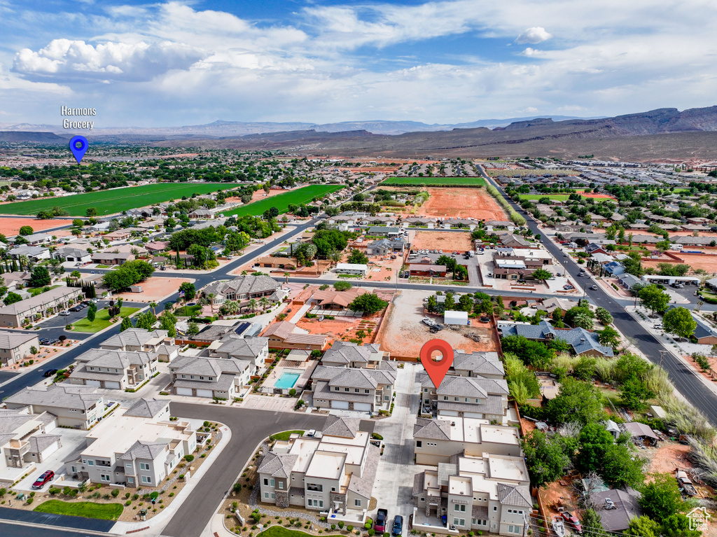 Aerial view of residential area featuring a mountainous background