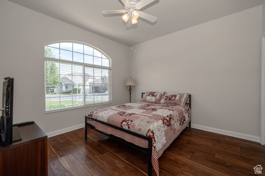 Bedroom featuring hardwood / wood-style floors and a ceiling fan