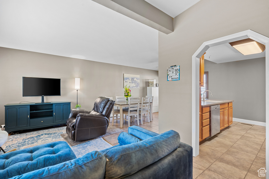Living room with light tile patterned floors and baseboards