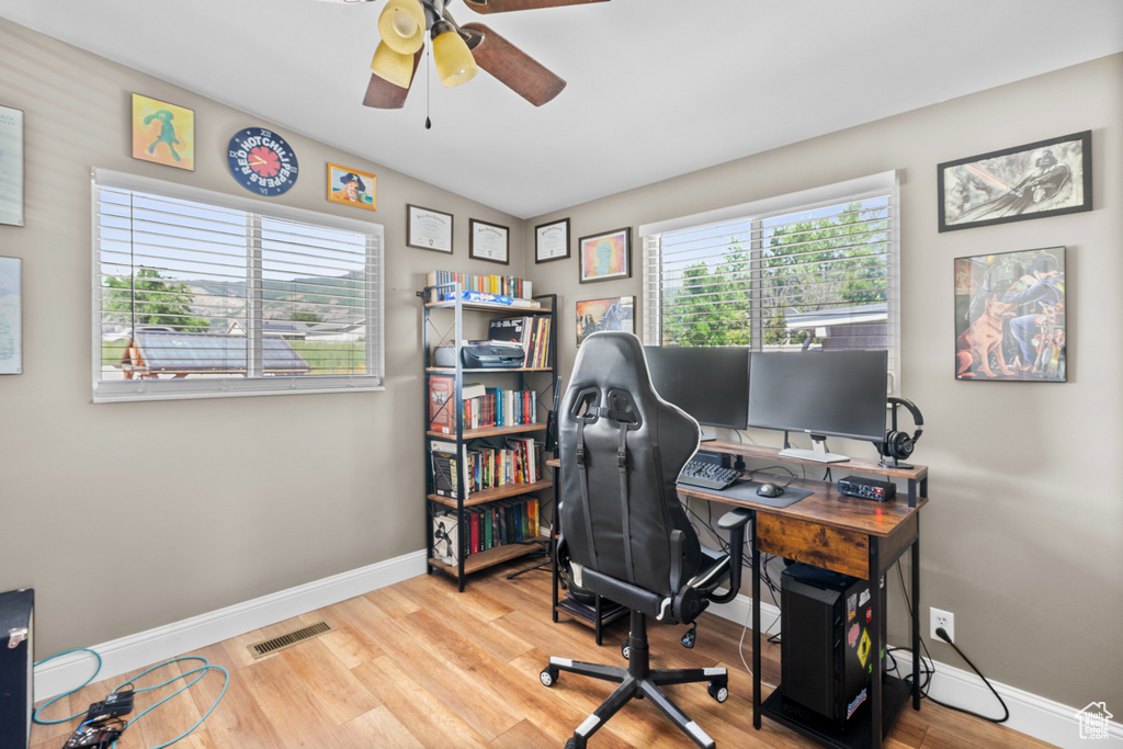Office area with ceiling fan and wood finished floors