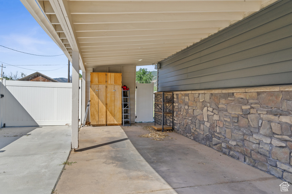 View of patio featuring a carport