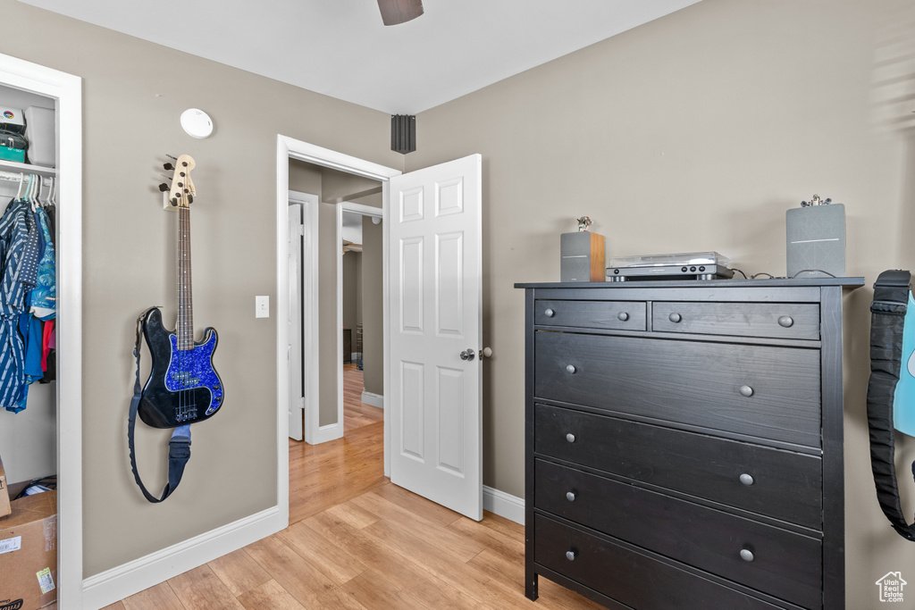 Bedroom featuring light wood-type flooring and a closet