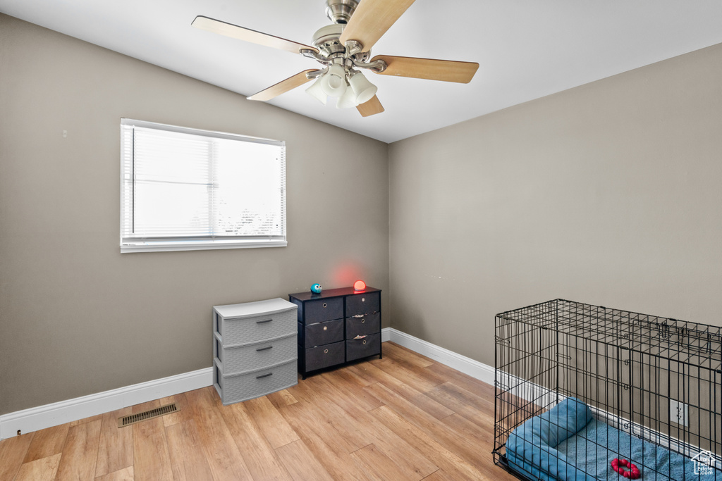 Unfurnished bedroom featuring light wood-style flooring and ceiling fan