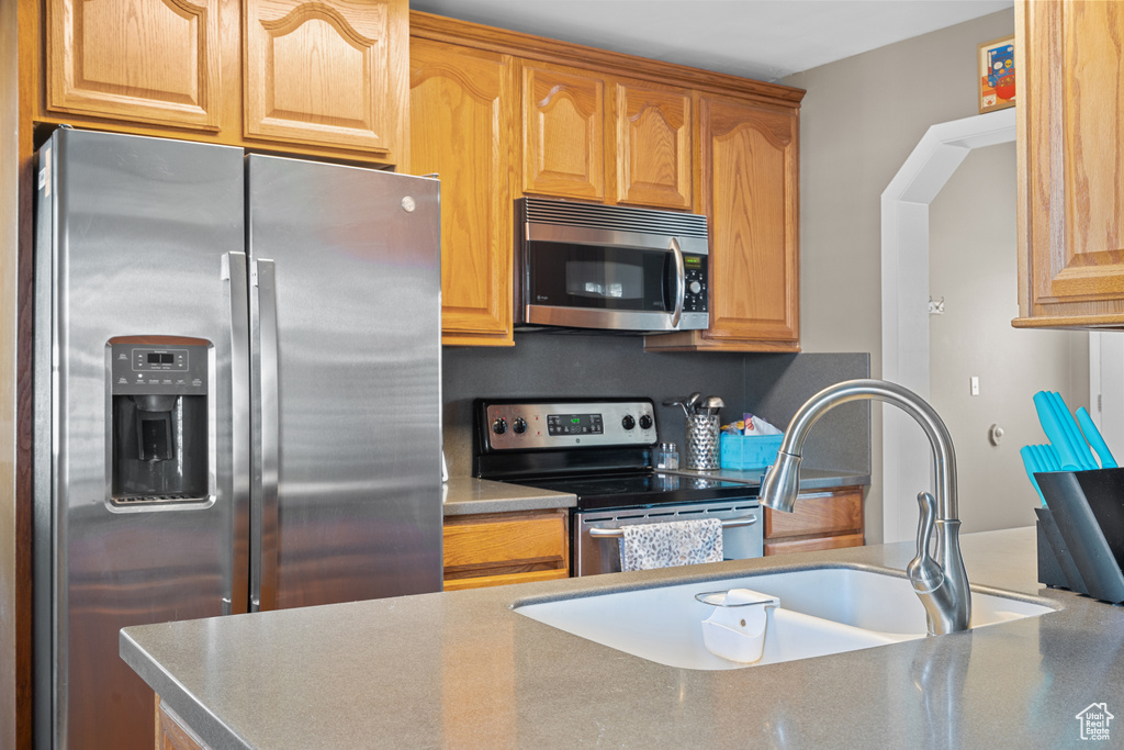Kitchen with stainless steel appliances and a sink