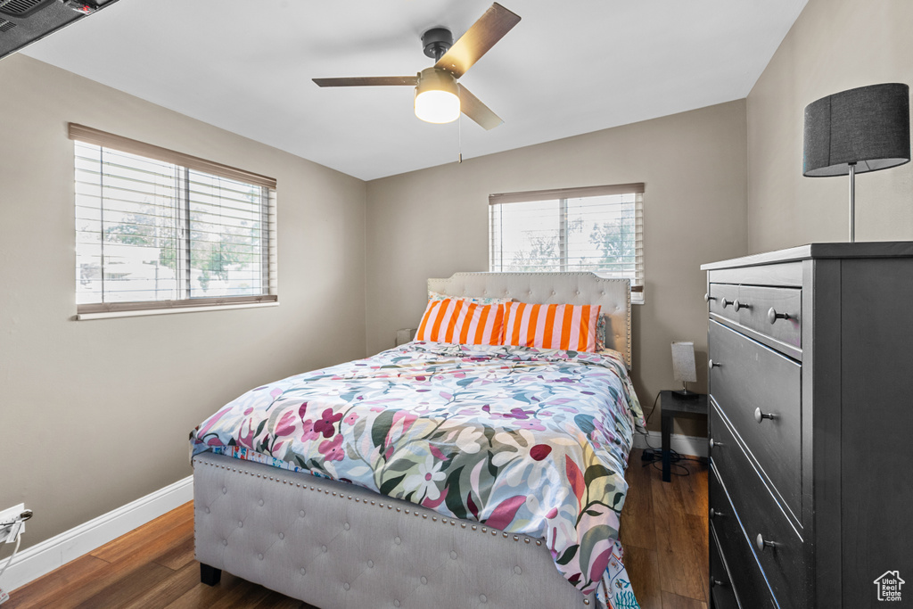Bedroom with wood finished floors and ceiling fan